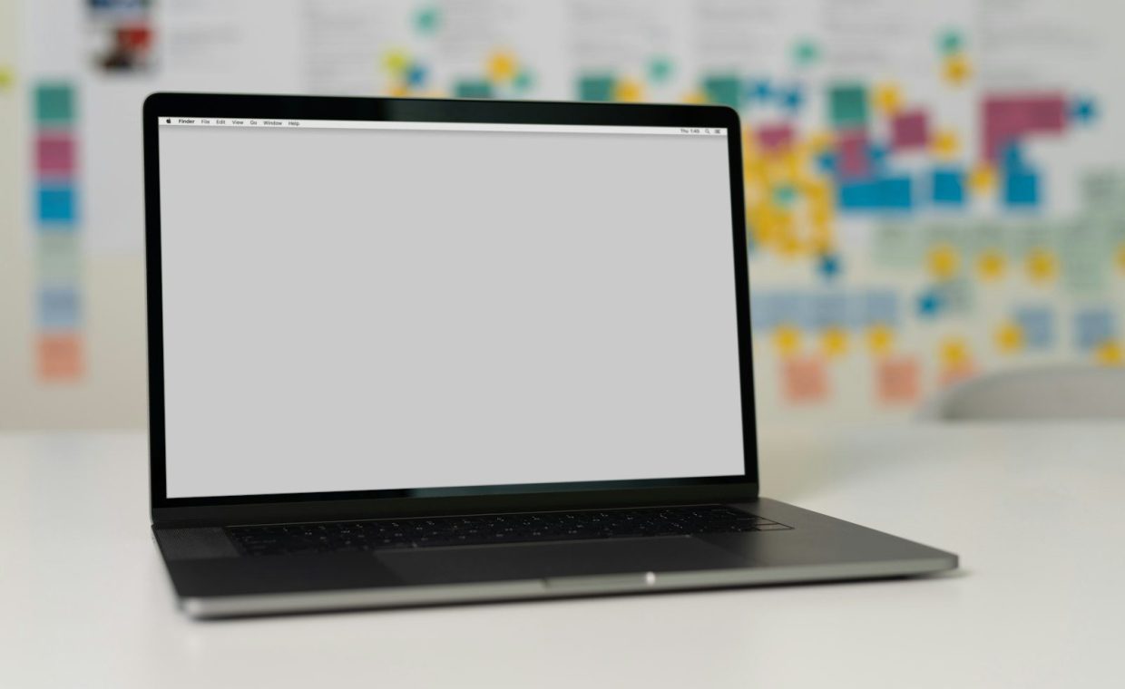 macbook pro on white table